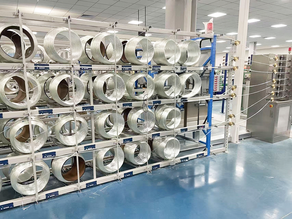 In which process links are peristaltic pumps applied in glass fiber production?